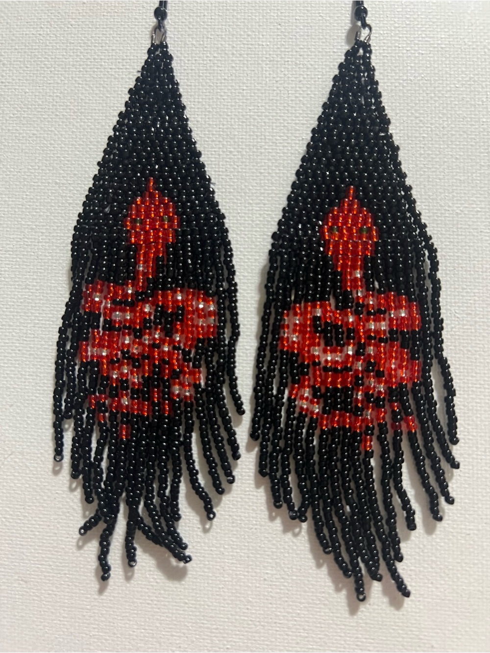 Black Beaded Fringe Earrings with Red Skull Accent